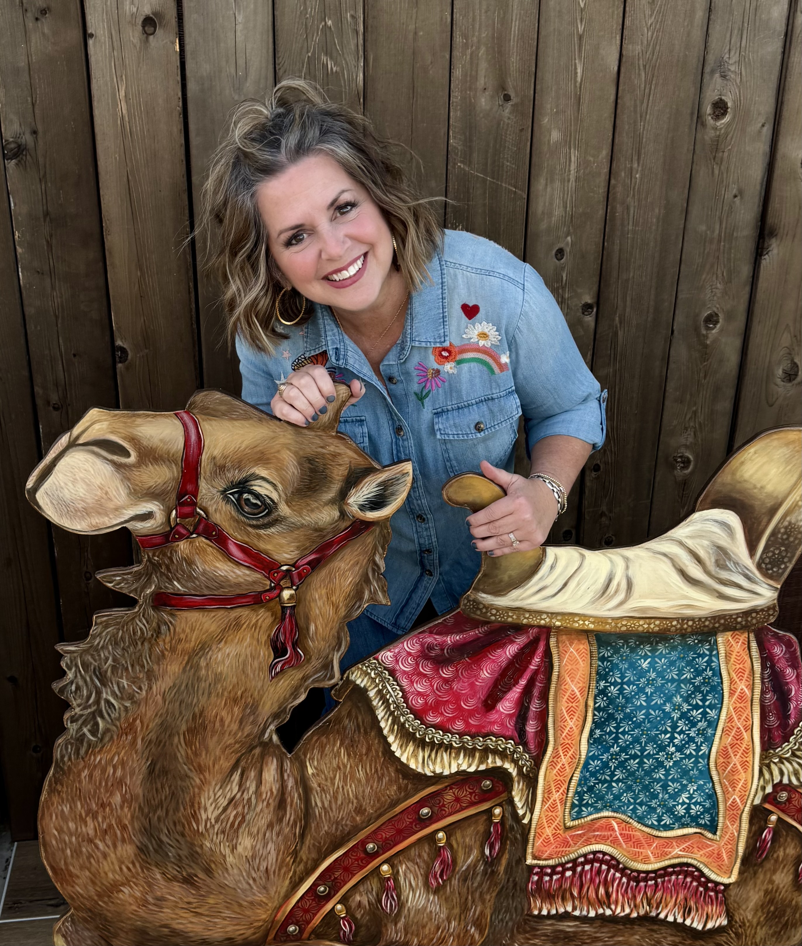 Dawn Vinklarek with one of her hand-painted Nativity pieces